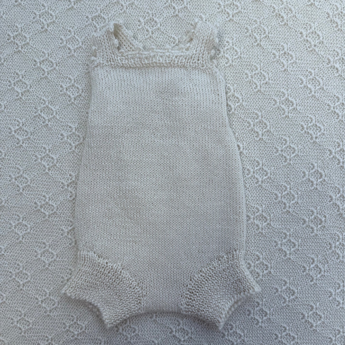 Poppy newborn alpaca romper with crochet straps front