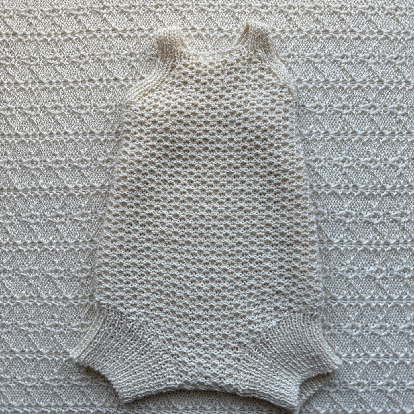 Eddie newborn alpaca baby romper front