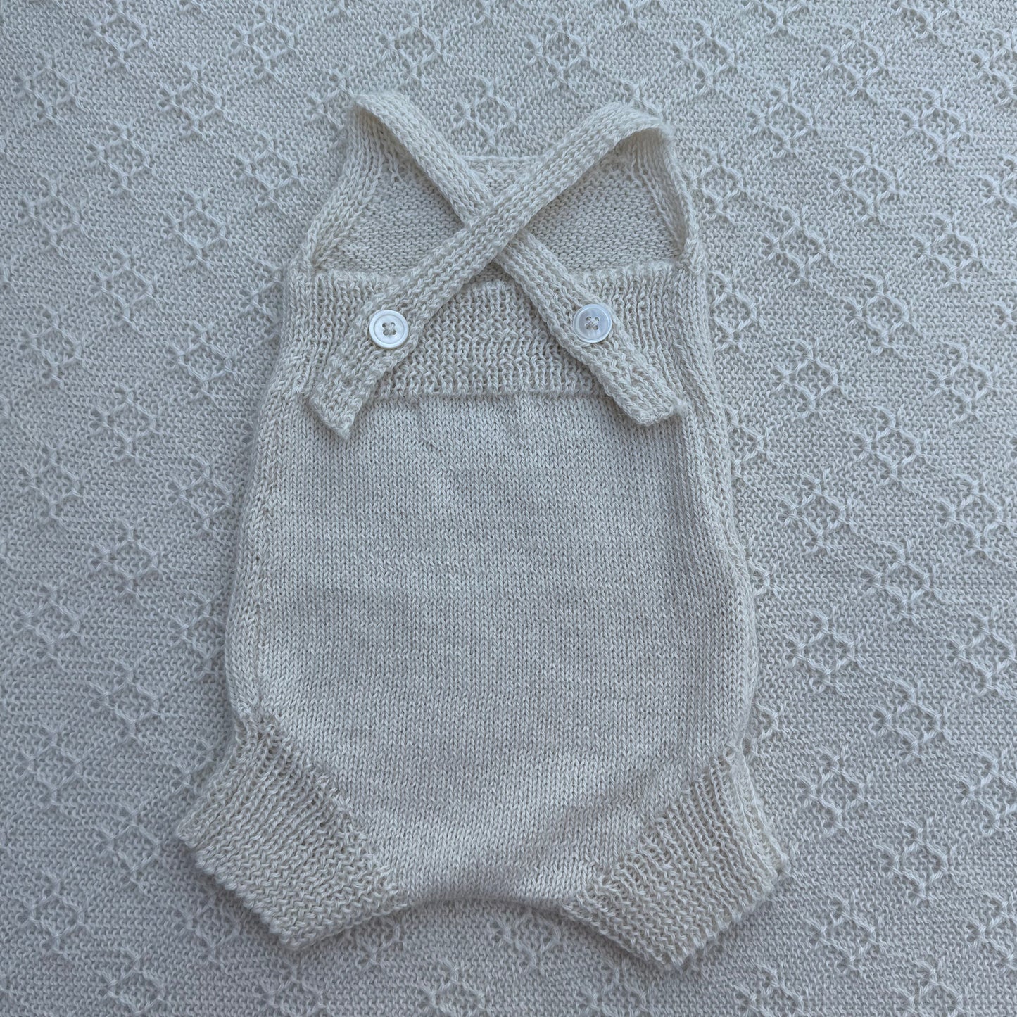 Poppy newborn alpaca romper with plain straps back
