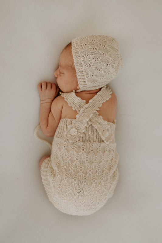 Handcrafted newborn romper made from soft, sustainable fibre. Breathable, gentle on delicate skin, and designed for comfort and warmth