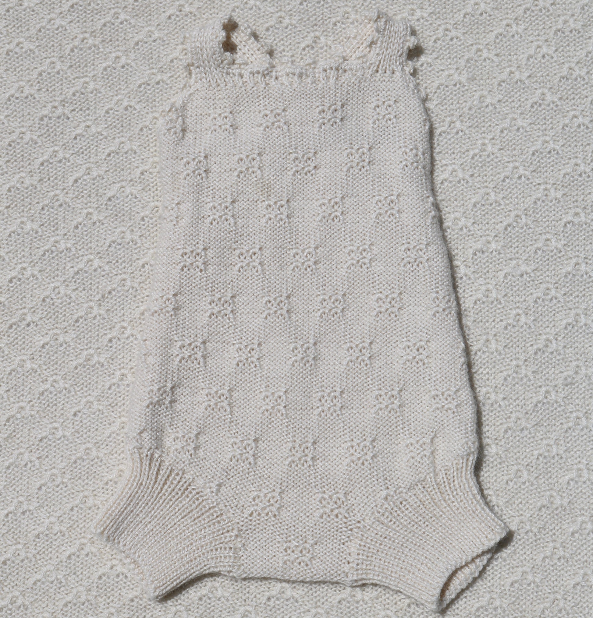 Charlie ivory alpaca romper with crochet straps front