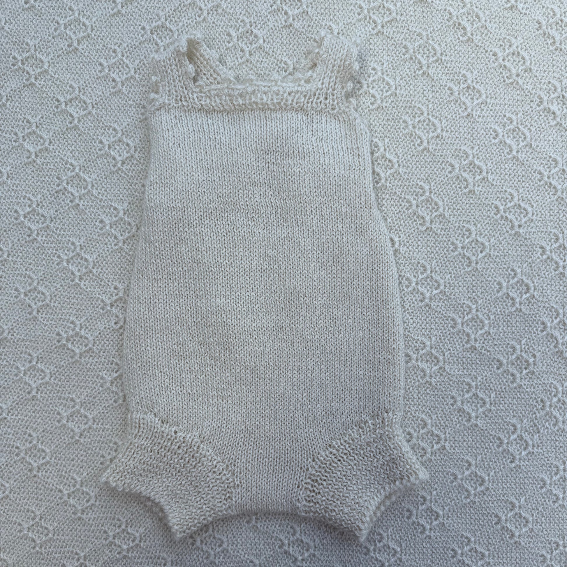 Poppy newborn alpaca romper with crochet straps front