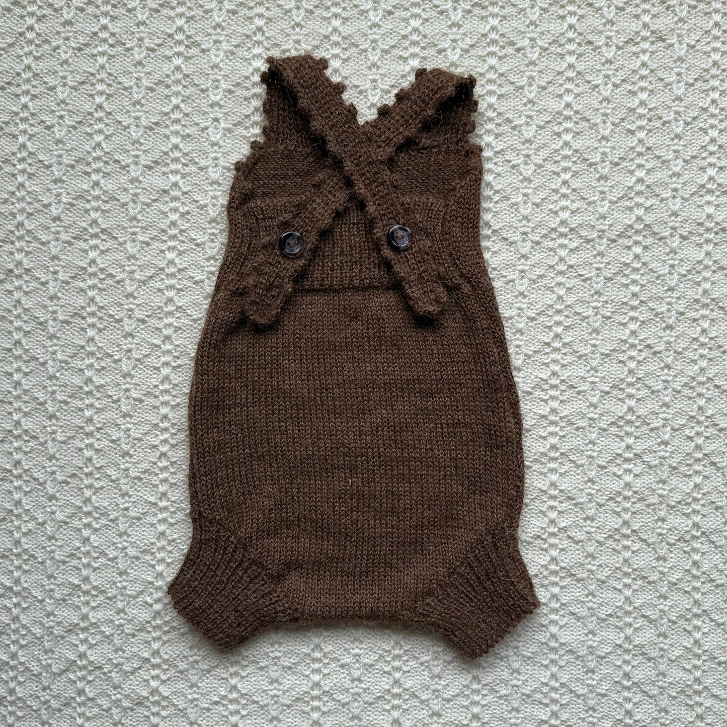 Chocolate Poppy plain knit newborn romper with crochet straps back
