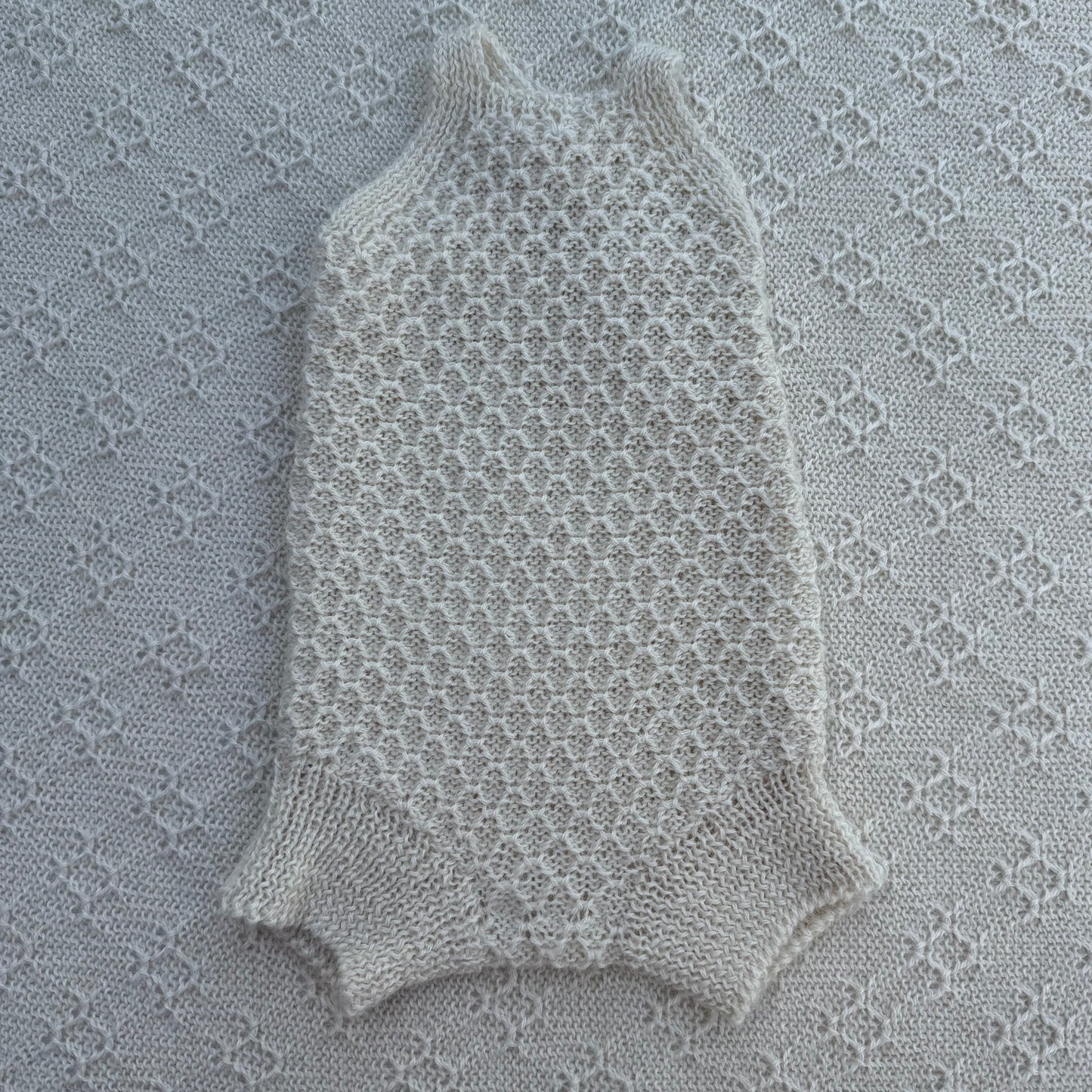 Everly newborn baby alpaca romper with plain straps front