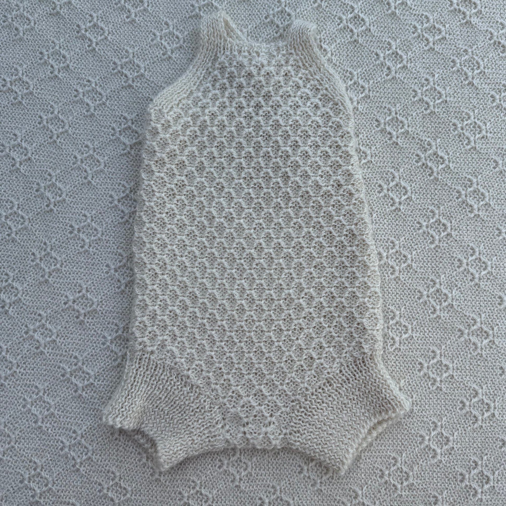 Everly newborn baby alpaca romper with plain straps front