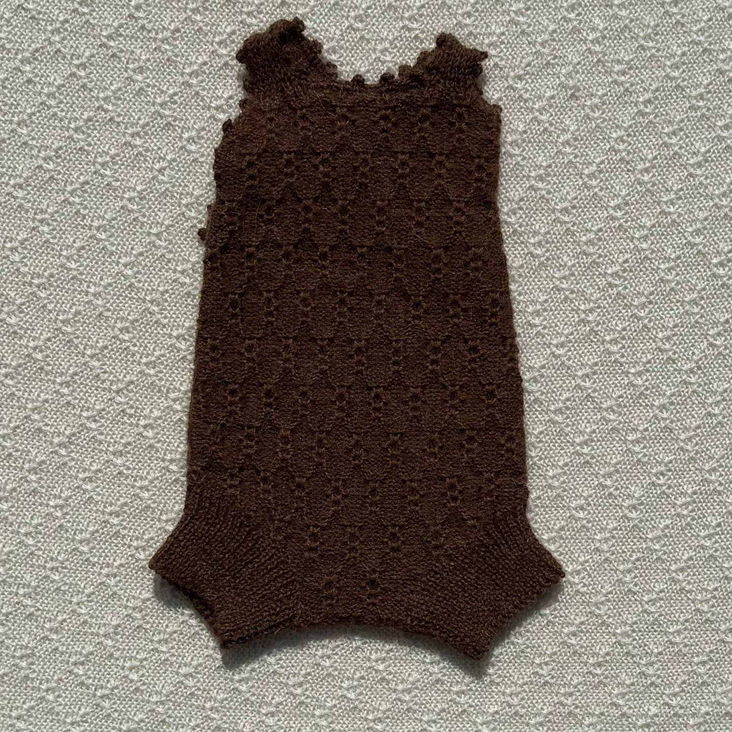 Chocolate Nellie alpaca romper crochet strap front