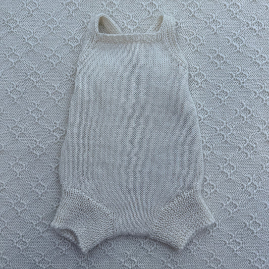 Poppy newborn alpaca romper with plain straps front