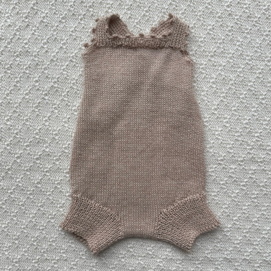 Tan baby alpaca poppy romper with crochet straps front