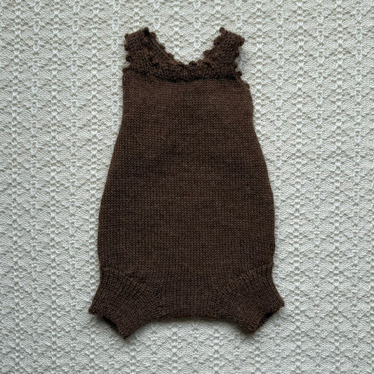 Chocolate Poppy plain knit newborn romper with crochet straps front