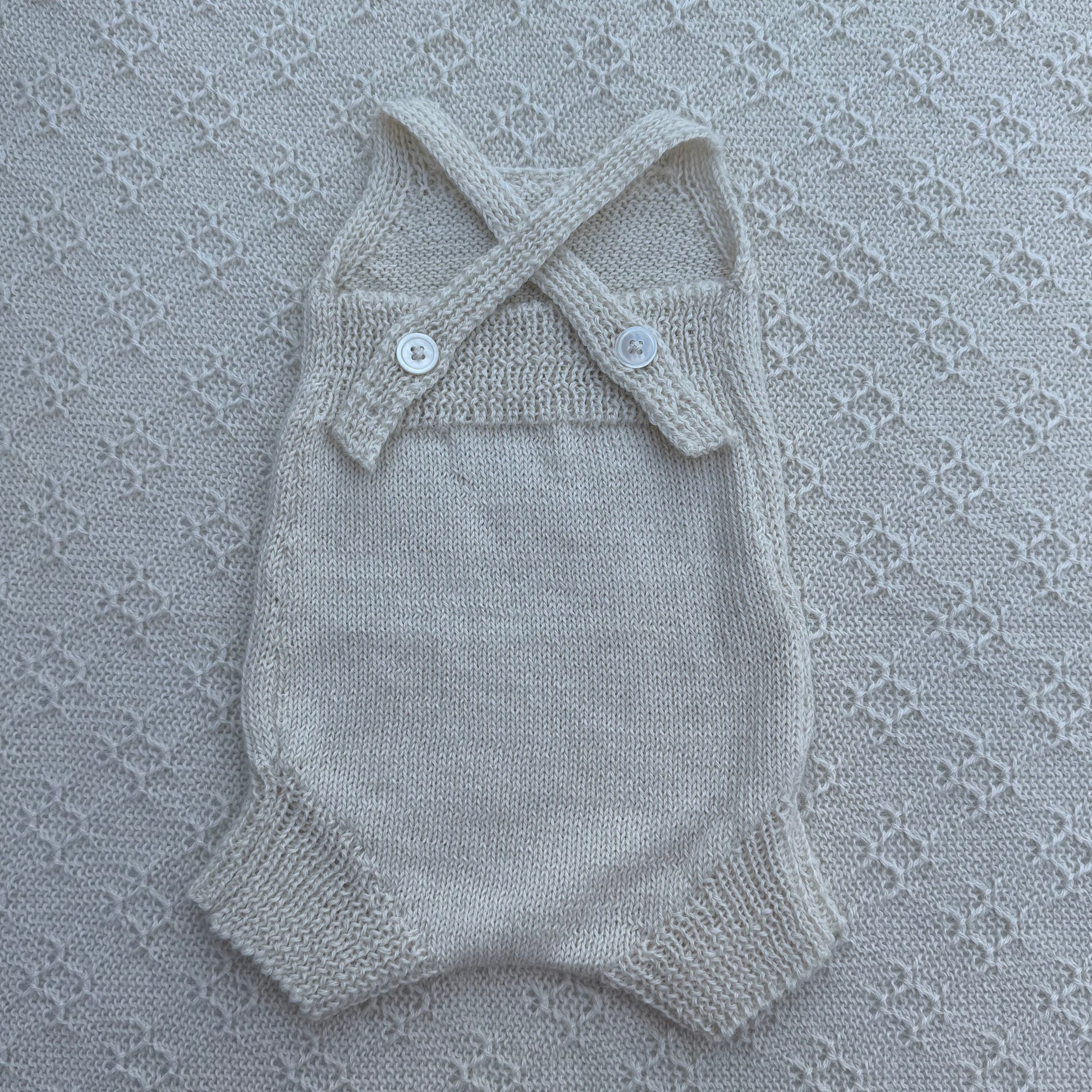 Poppy newborn alpaca romper with plain straps back