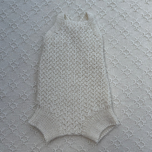 Ezra newborn baby alpaca romper with plain straps front